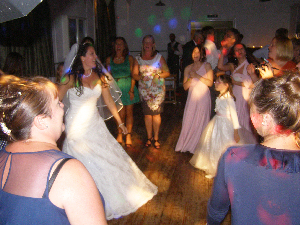 A very happy bride and her besties at Kent Life Image